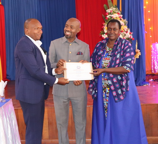 Dr. Justin Kyalo, PhD, Chairman, Department of Social Sciences awarded a certificate by the Vice Chancellor, Machakos University, for emerging the best lecturer in his School for the Year 2023